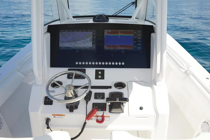 Slide: The Image of 2023 Regulator 28 boat dashboard with navigation and control systems. - 6