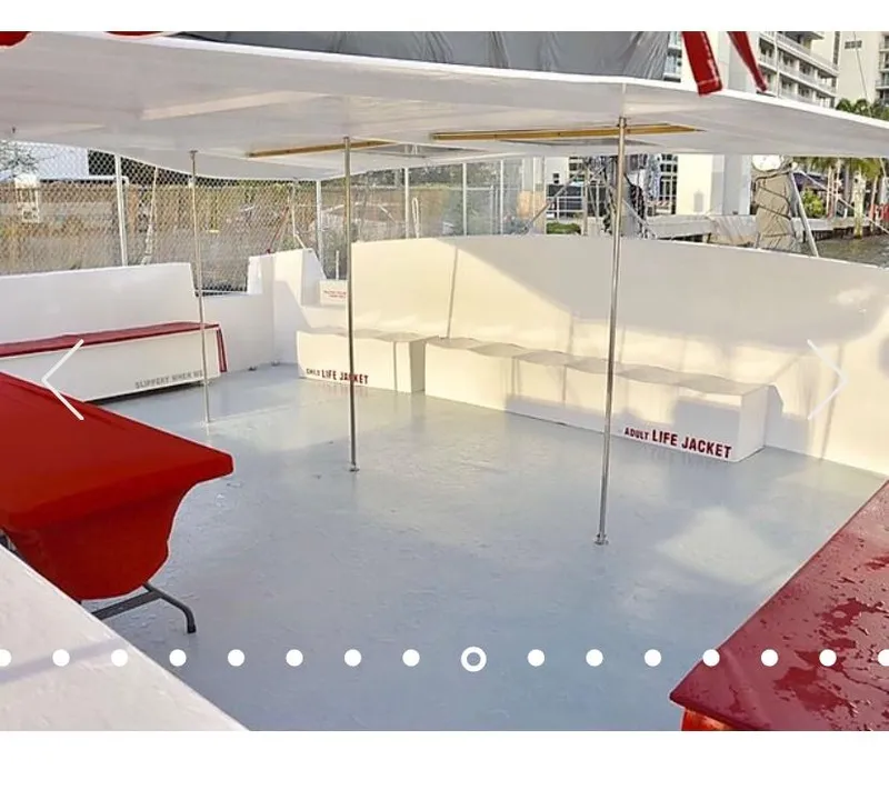 Slide: The Image of Spacious deck of 1987 Custom Suncoast Catamaran with seating and life jacket storage. - 9