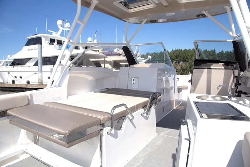 Slide: The Image of 2020 Cutwater 24 DC Dual Console boat interior with seating and amenities. - 14