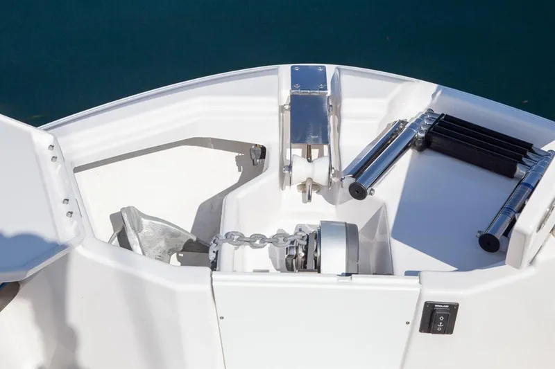 Slide: The Image of 2020 Cutwater 24 DC boat anchor compartment with chain and ladder. - 6