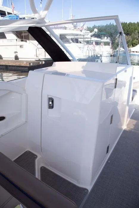 Slide: The Image of 2020 Cutwater 24 DC Dual Console boat interior with sleek white design. - 9