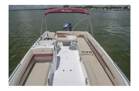 Slide: The Image of 2017 Hurricane SS 201 boat with beige seating and red canopy on calm water. - 3