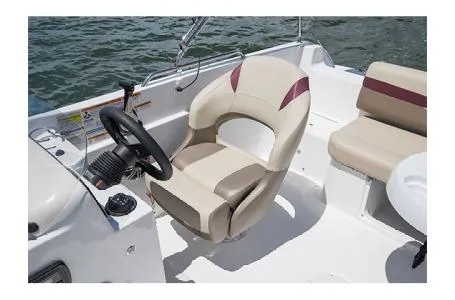 Slide: The Image of 2017 Hurricane SS 201 boat interior with steering wheel and seating on water. - 5