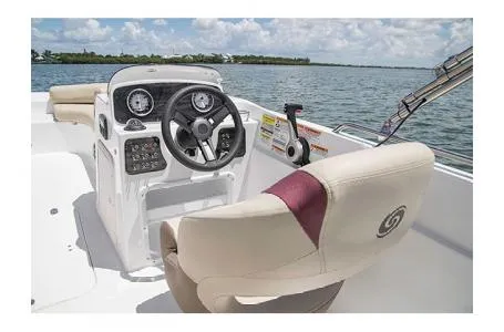 Slide: The Image of 2017 Hurricane SS 201 boat interior with steering wheel and comfortable seating. - 7