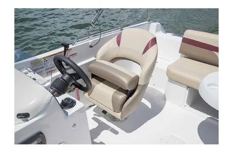 Slide: The Image of 2017 Hurricane SS 201 boat interior with steering wheel and seating. - 9