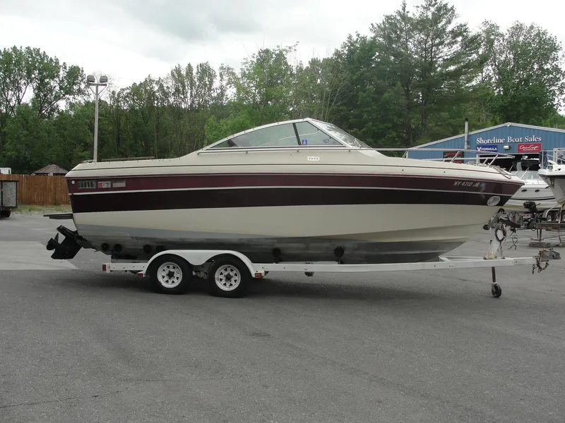 Slide: The Image of 1987 Cobalt Condesa boat on a trailer in a parking lot. - 5