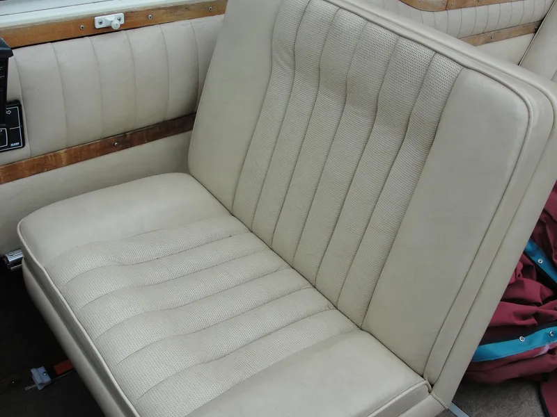 Slide: The Image of 1987 Cobalt Condesa beige leather boat seat with wood trim. - 7