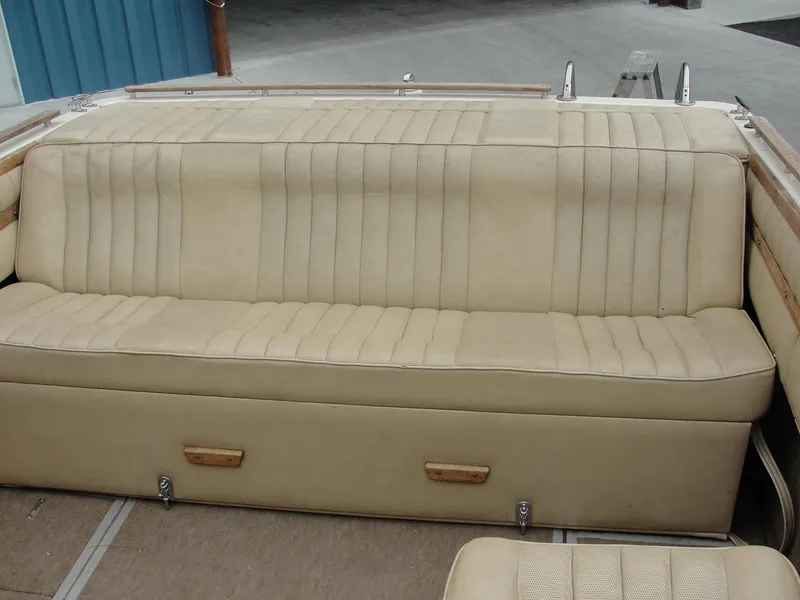 Slide: The Image of 1987 Cobalt Condesa boat beige leather rear bench seat with storage compartments. - 8