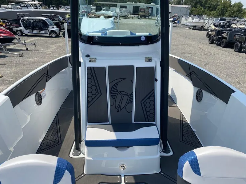 Slide: The Image of 2021 Scarab 255 Open ID boat interior with seating and storage compartments. - 11