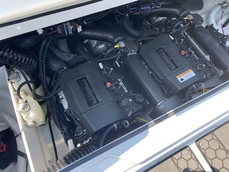 Slide: The Image of 2021 Scarab 255 Open ID engine compartment with dual Rotax engines. - 2