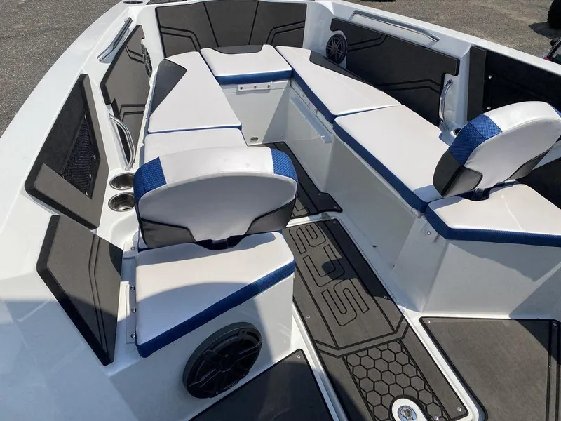 Slide: The Image of 2021 Scarab 255 Open ID boat interior with white and blue seating. - 3