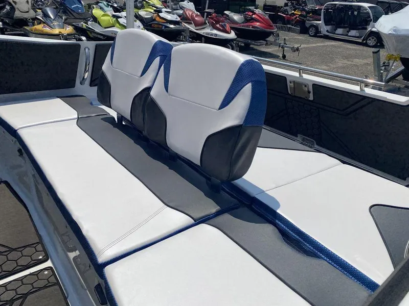 Slide: The Image of 2021 Scarab 255 Open ID boat interior with white and blue seating. - 5