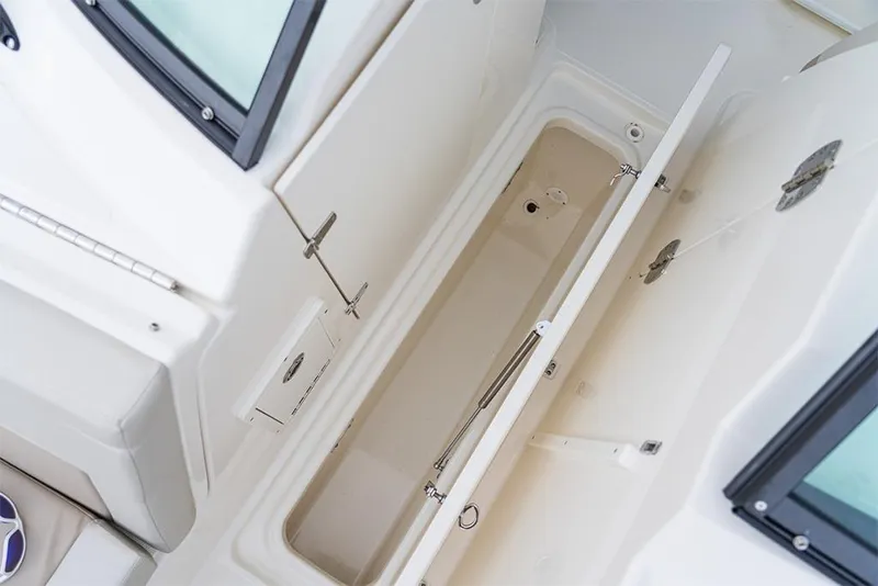 Slide: The Image of 2023 Boston Whaler 240 Vantage storage compartment. - 28