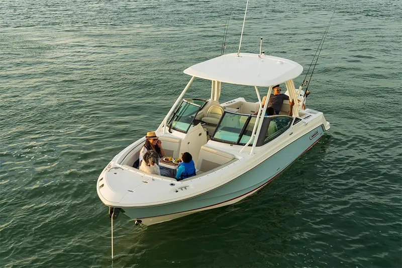 Slide: The Image of 2023 Boston Whaler 240 Vantage boat on water with passengers enjoying a day out. - 6