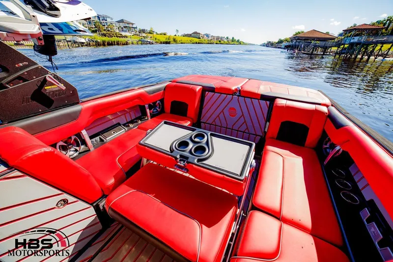 Slide: The Image of 2019 Malibu Wakesetter 25 LSV with red interior on a scenic waterway. - 7