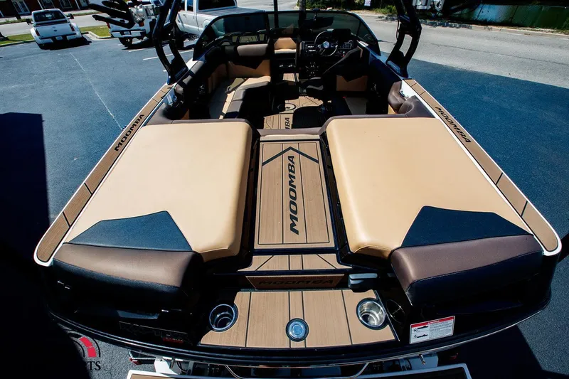 Slide: The Image of 2020 Moomba Kaiyen boat interior with tan and black seating. - 5