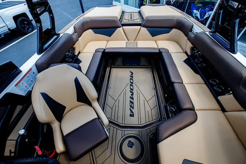 Slide: The Image of 2020 Moomba Kaiyen boat interior with tan and brown seating. - 7