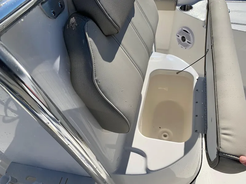 Slide: The Image of 2024 Key West 210 Bay Reef boat with open storage compartment under seat. - 14