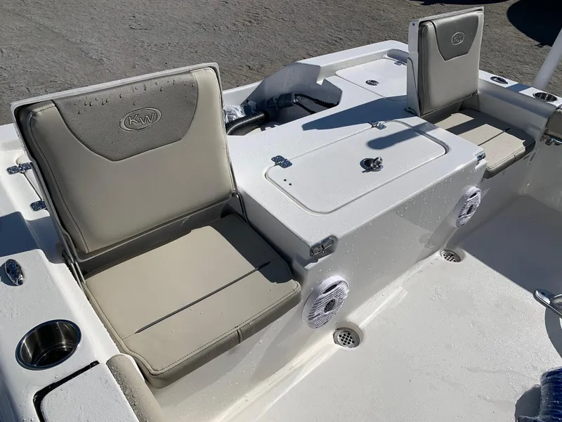 Slide: The Image of 2024 Key West 210 Bay Reef boat interior seating and storage compartments. - 5