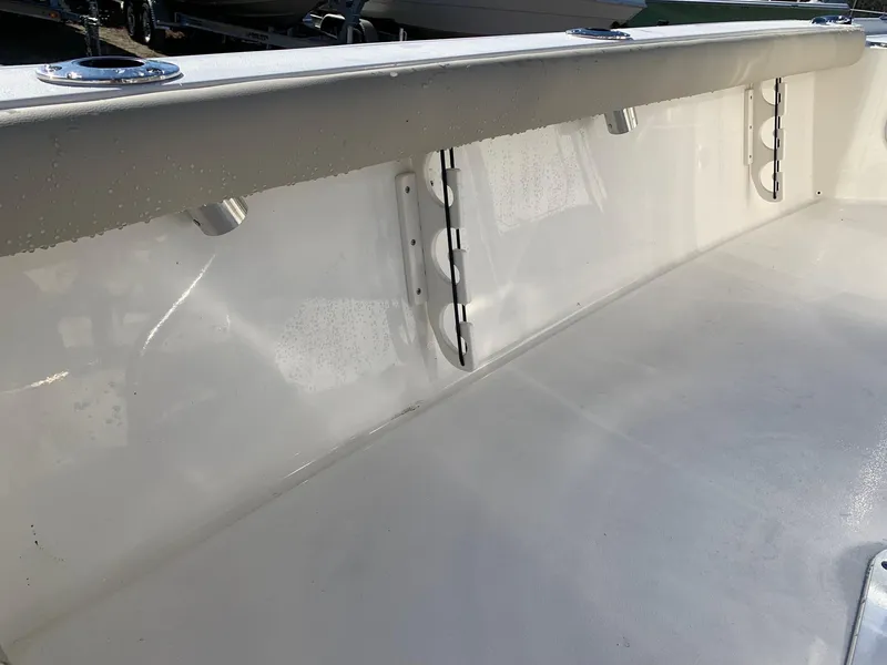 Slide: The Image of 2024 Key West 210 Bay Reef boat interior, white deck and side panel. - 11