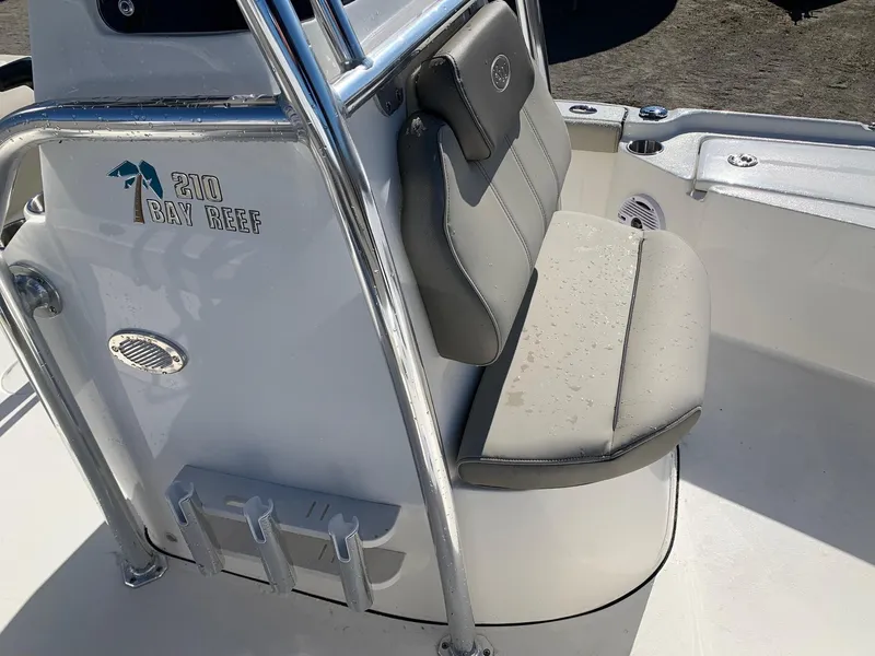 Slide: The Image of 2024 Key West 210 Bay Reef boat interior with cushioned seating. - 14