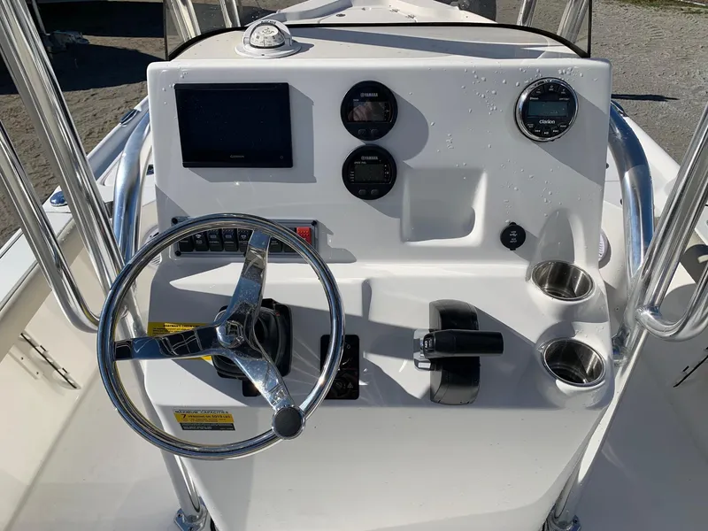 Slide: The Image of 2024 Key West 210 Bay Reef boat console with steering wheel and gauges. - 7