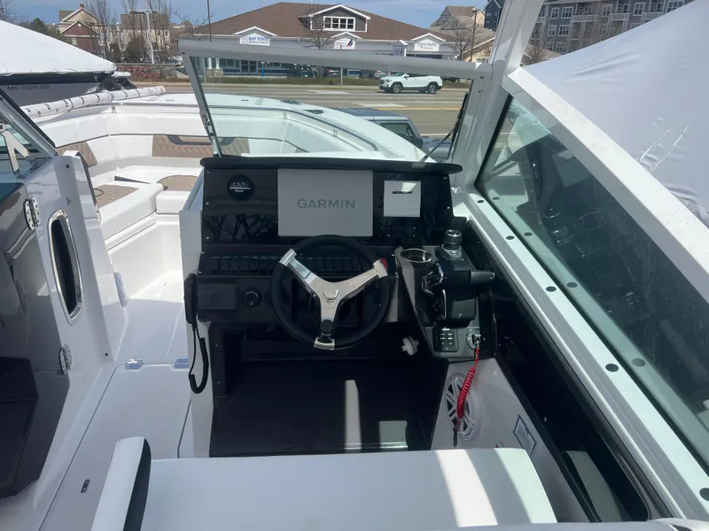 Slide: The Image of 2024 Blackfin 272DC boat cockpit with Garmin navigation system. - 17