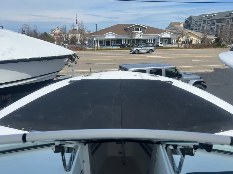 Slide: The Image of 2024 Blackfin 272DC boat on display at a dealership. - 4