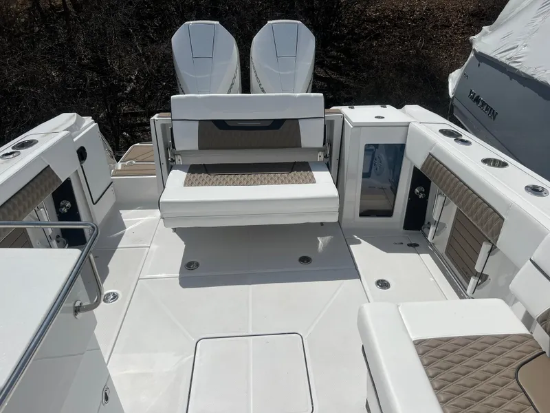 Slide: The Image of 2024 Blackfin 272DC boat interior with seating and twin engines. - 7