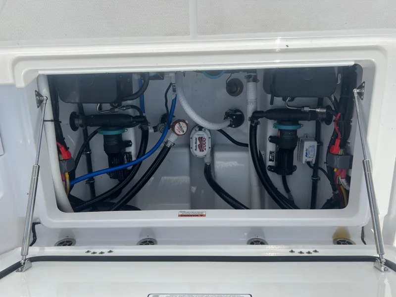 Slide: The Image of 2024 Blackfin 272DC boat engine compartment with wiring and components. - 9