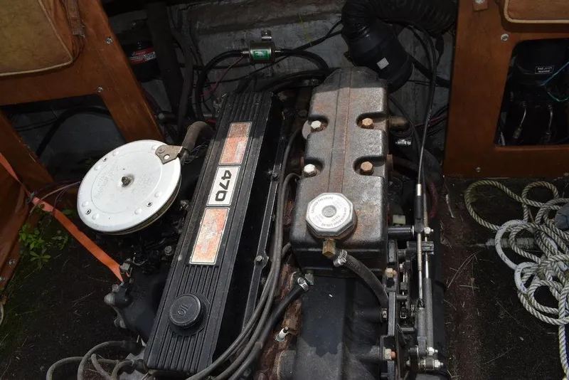 Slide: The Image of Engine of 1983 Rinker 204 Cuddy Cabin boat with visible components and wiring. - 10