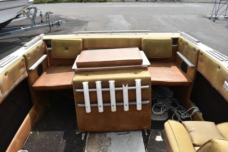 Slide: The Image of 1983 Rinker 204 Cuddy Cabin boat interior with seating and storage compartments. - 4