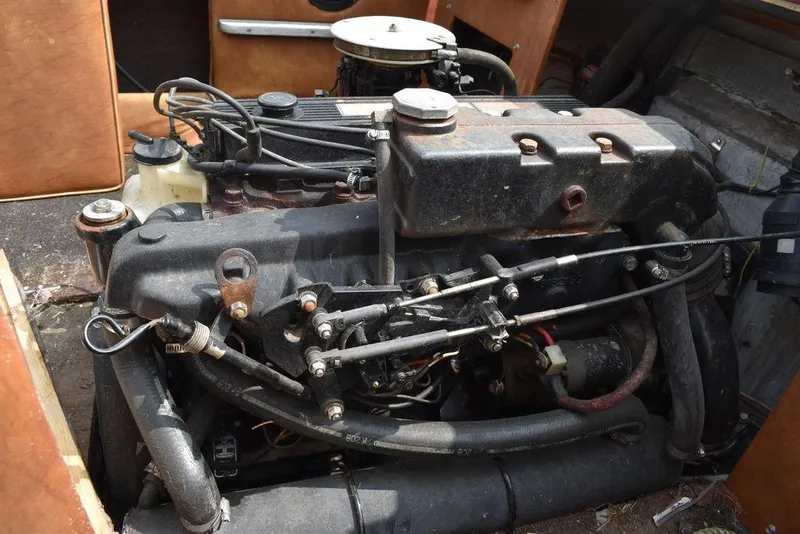 Slide: The Image of Engine of 1983 Rinker 204 Cuddy Cabin boat, detailed view. - 9