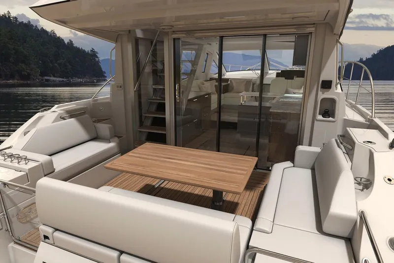 Slide: The Image of Luxurious 2018 Sea Ray Fly 520 yacht with elegant outdoor seating and scenic water view. - 4