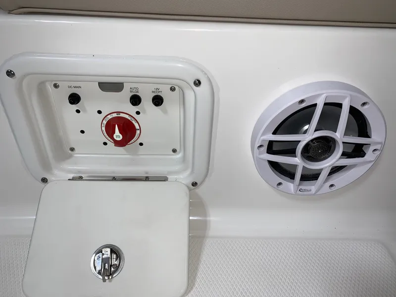 Slide: The Image of 2026 Robalo 226 Cayman boat control panel and speaker detail. - 8