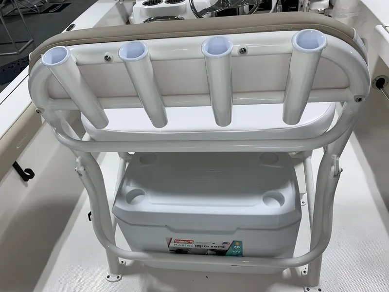 Slide: The Image of 2026 Robalo 226 Cayman boat with rod holders and cooler storage. - 13