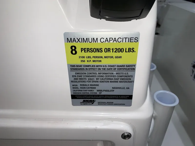Slide: The Image of 2026 Robalo 226 Cayman capacity label, maximum 8 persons or 1200 lbs, 250 HP motor. - 15