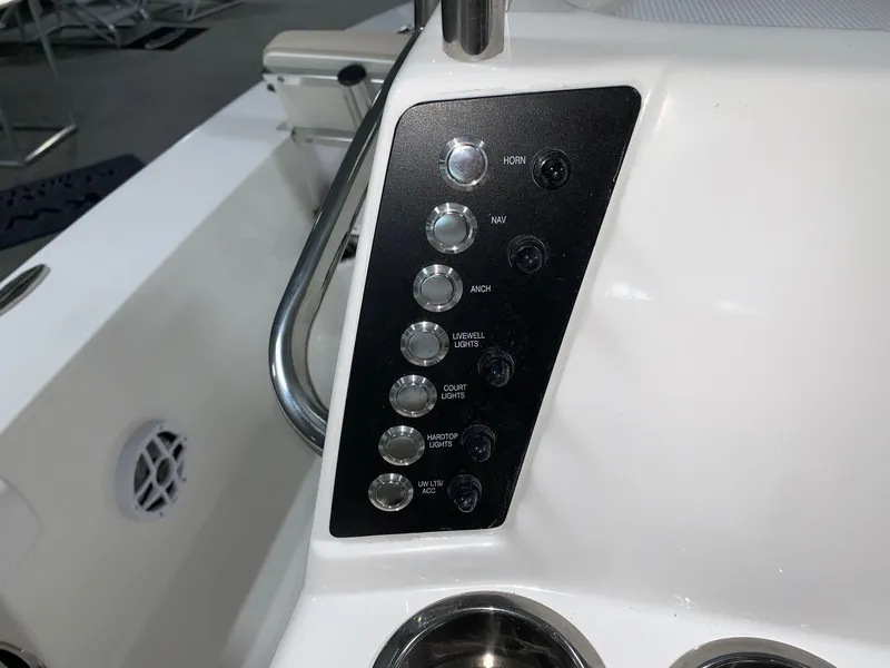 Slide: The Image of Control panel of 2026 Robalo 226 Cayman boat with labeled switches. - 16