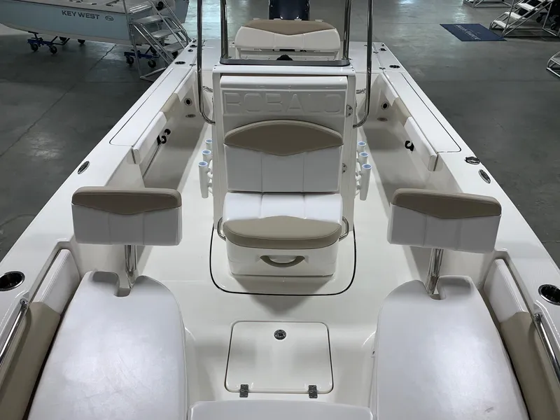 Slide: The Image of 2026 Robalo 226 Cayman boat interior with seating and storage compartments. - 6