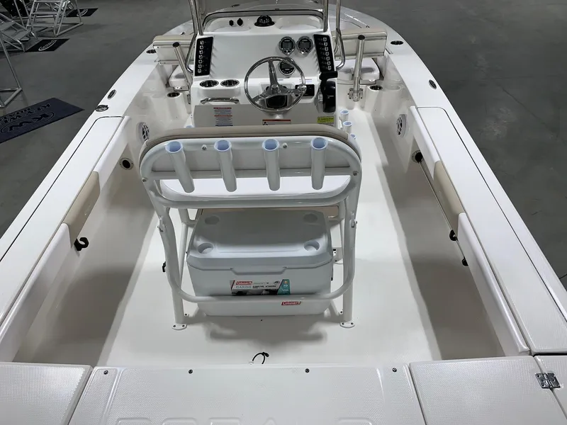 Slide: The Image of 2026 Robalo 226 Cayman boat interior with steering console and seating arrangement. - 7