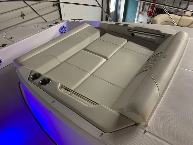 Slide: The Image of 2023 Regal 36XO boat with luxurious seating and cup holders. - 18