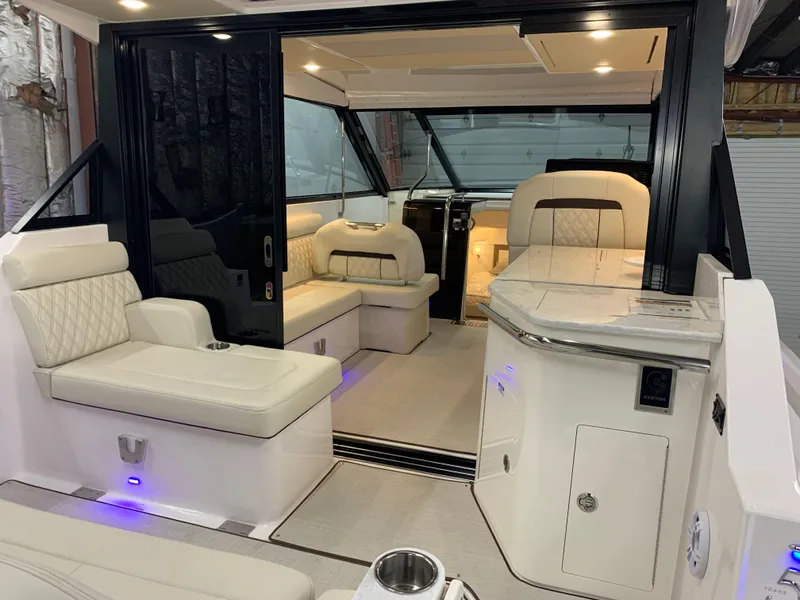 Slide: The Image of Luxurious interior of a 2023 Regal 36XO yacht with plush seating and modern amenities. - 4