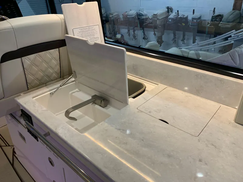 Slide: The Image of 2023 Regal 36XO yacht interior kitchen sink and countertop. - 8