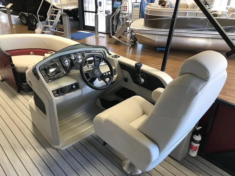Slide: The Image of Interior of a 2021 Avalon 2285 LSZ CRUISE boat with helm console. - 5