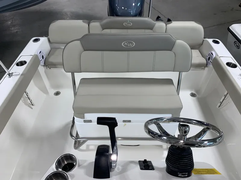 Slide: The Image of 2024 Key West 189 FS boat interior with dual seating and steering wheel. - 11