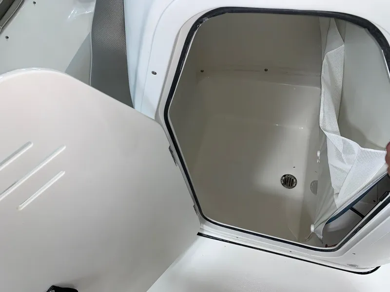Slide: The Image of 2024 Key West 189 FS storage compartment with open hatch. - 6