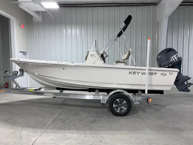Slide: The Image of 2024 Key West 188 Bay Reef boat on trailer in indoor storage. - 0