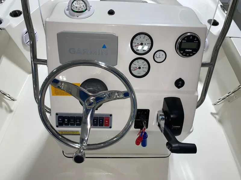 Slide: The Image of Steering console of 2026 Key West 188 Bay Reef boat with gauges and controls. - 16