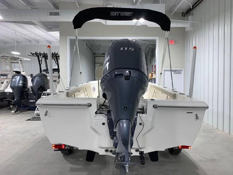 Slide: The Image of 2026 Key West 188 Bay Reef boat with 115 HP engine in showroom. - 2