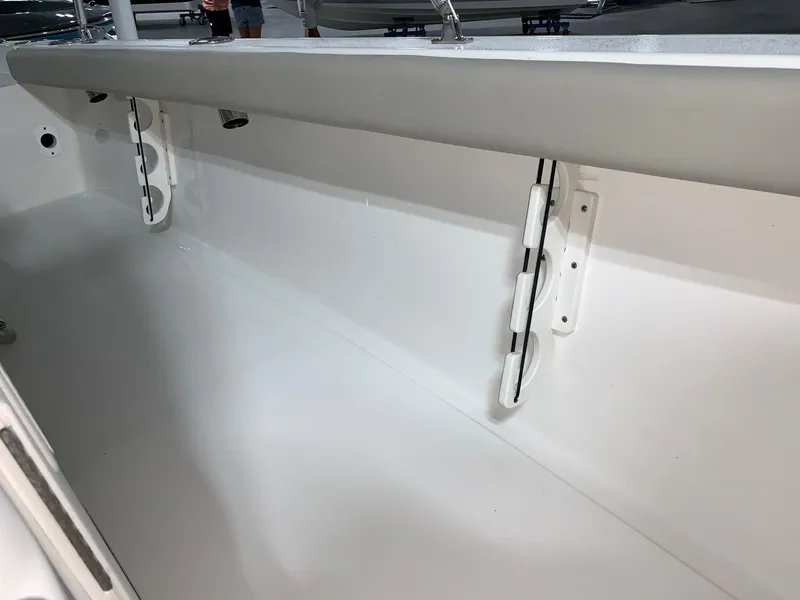 Slide: The Image of 2026 Key West 188 Bay Reef boat interior, showcasing sleek white design and storage features. - 21